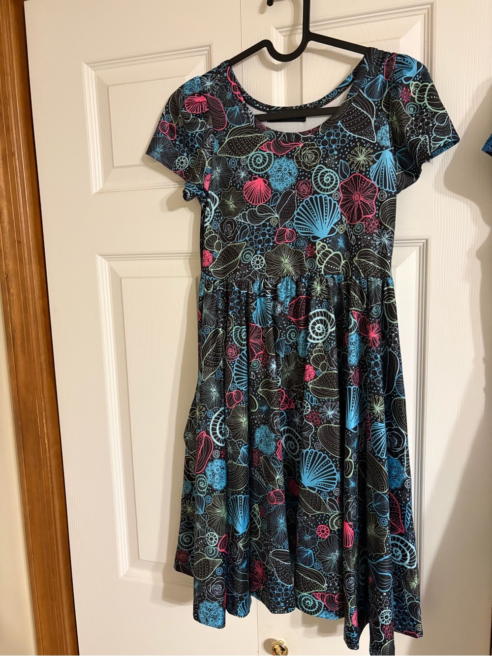Charlie’s Project Girls Black Seashell Print Dress with Blue and Pink Accents